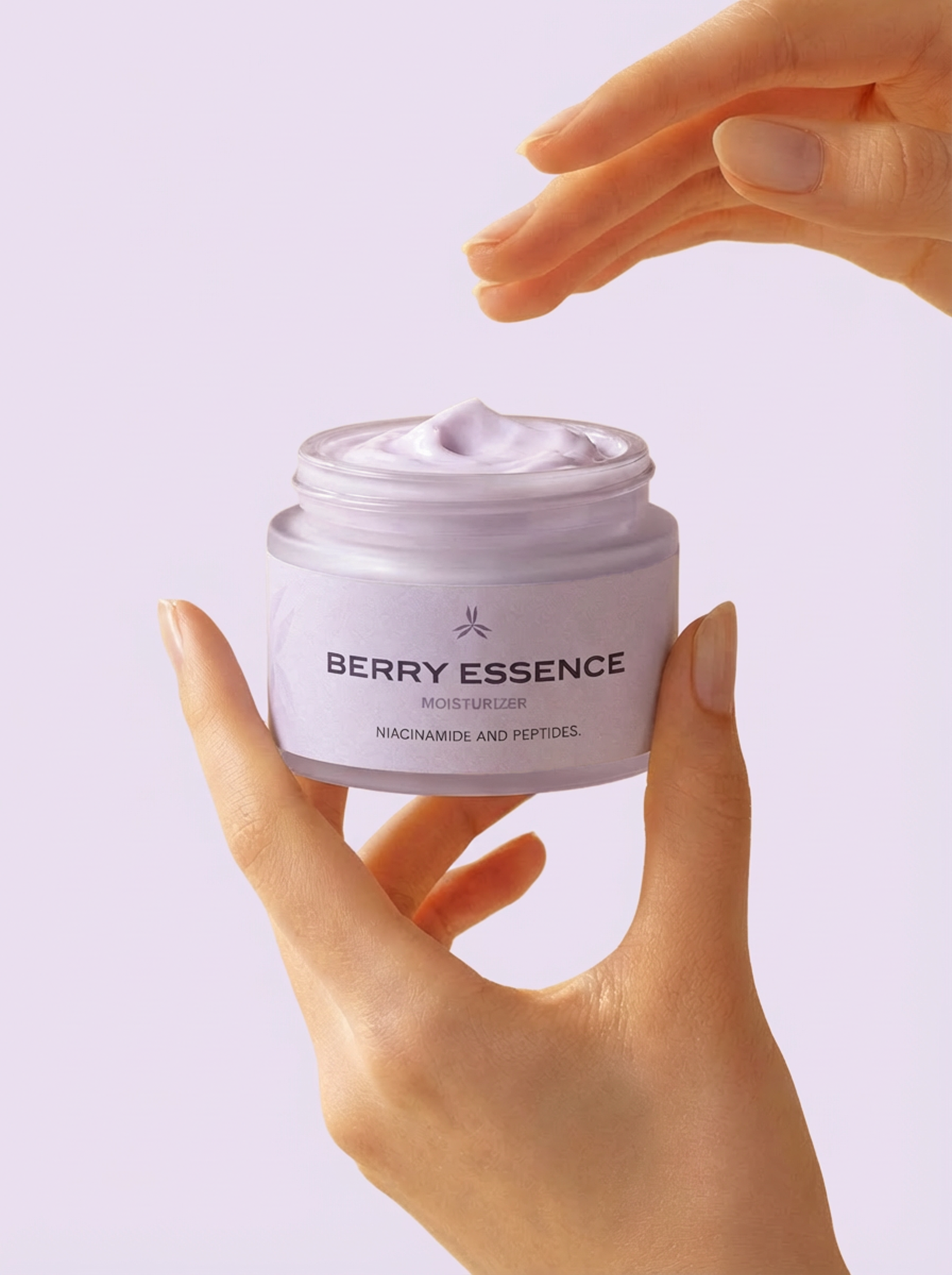 Jar of 'Berry Essence' cream held by a hand against a light purple background
