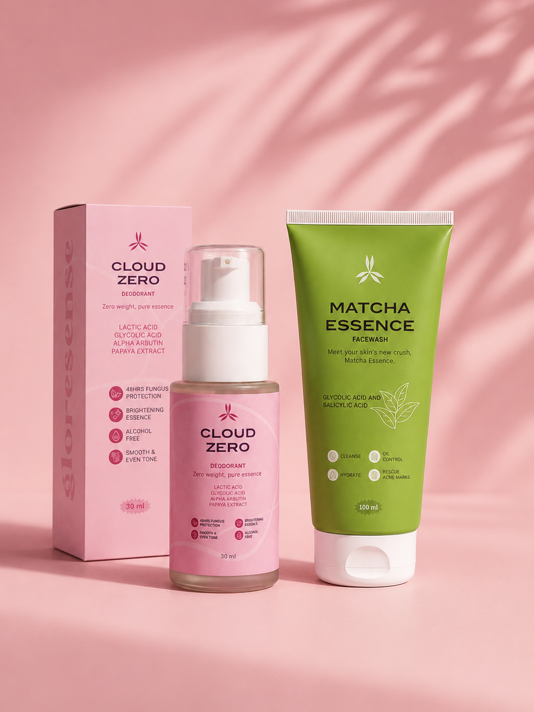Skincare products including a bottle and tube on a pink background